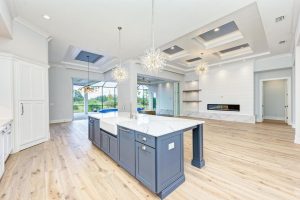 Custom home and kitchen design. Gray wood and marble modern design kitchen center island & breakfast bar.