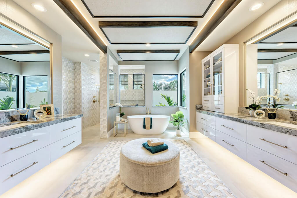 a large custom bathroom in a home with mirrors and a luxury design sink