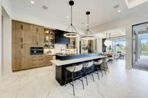 a luxury kitchen island and living room from a custom home builder
