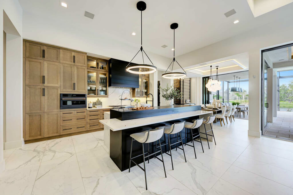 a luxury kitchen island and living room from a custom home builder