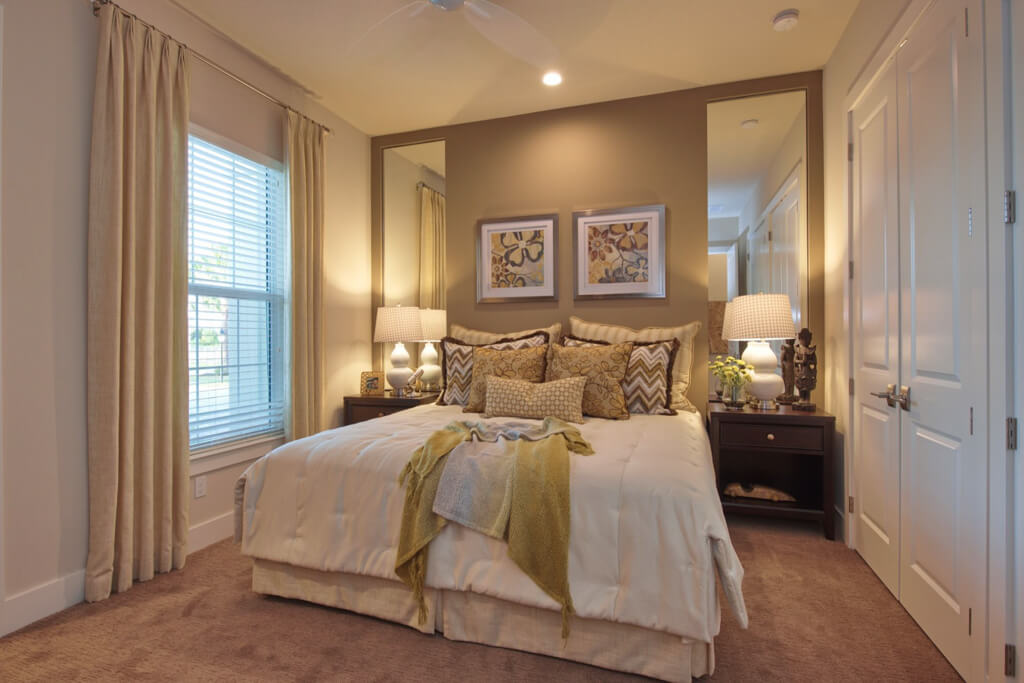 a custom bedroom in a home with a soft lighting design
