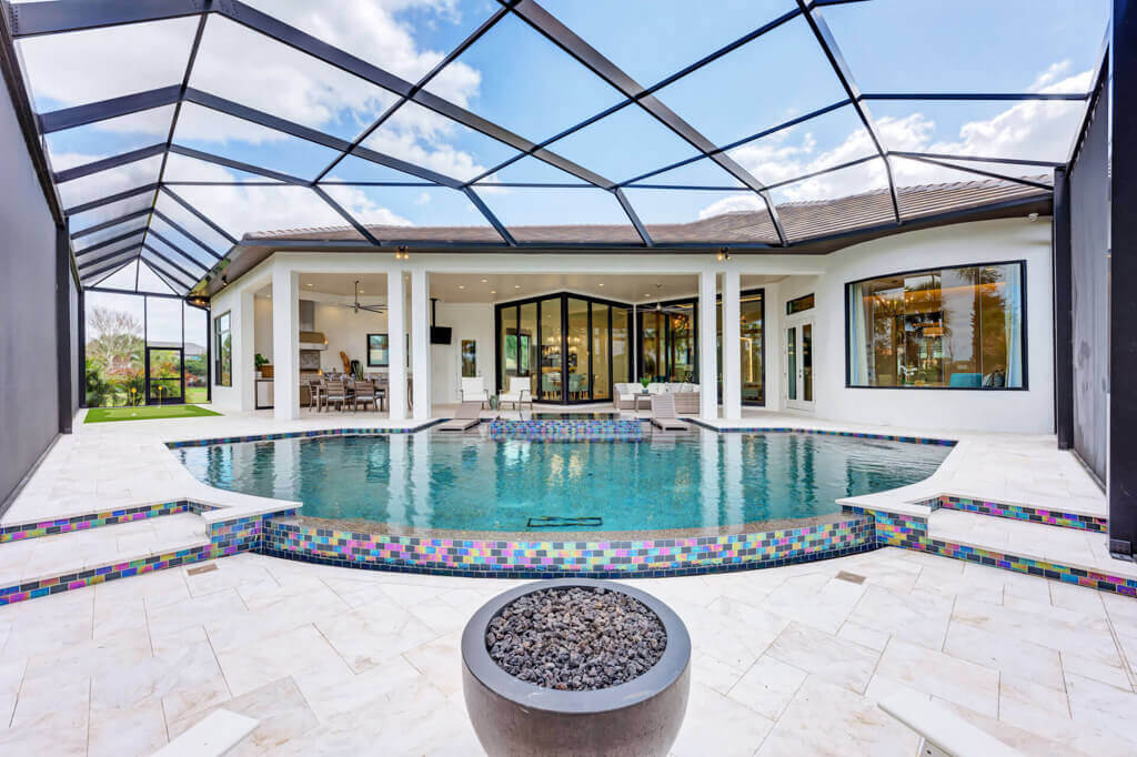 Pool area designed by Lee Wetherington Homes, custom home builder Sarasota