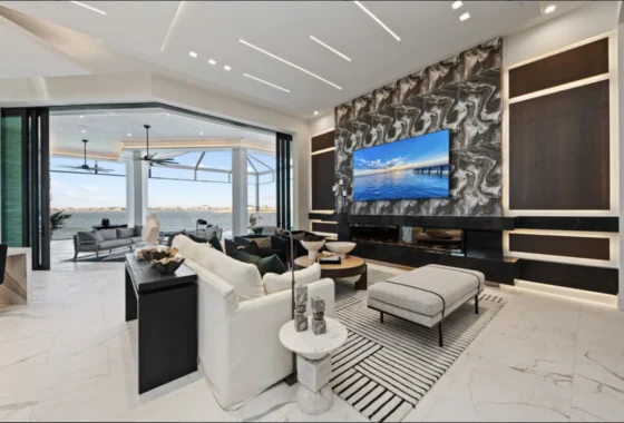 Modern living room showcasing elegant furniture, natural light, and luxurious finishes, exemplifying top luxury home designs.