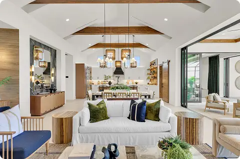 Open concept living space inside luxury homes in Florida with wood beams, modern furniture, and seamless indoor-outdoor connection.