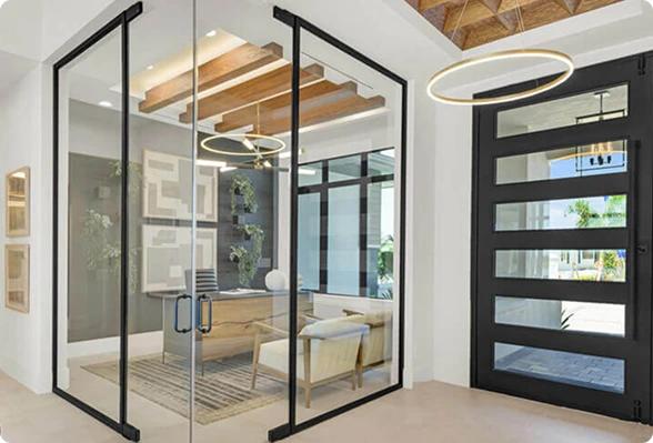 Luxury custom home interior featuring a sophisticated home office with custom built-in cabinetry, elegant furnishings, natural light, and an open-concept living space designed for modern coastal living.