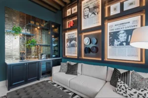 Sarasota luxury home interior with statement artwork, curated framed art collection, sculptural chair, and tailored furnishings.