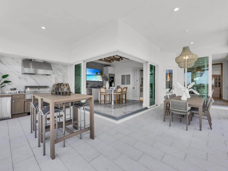 Caravel-luxury-model-home-Exterior_Living_Dining_Room